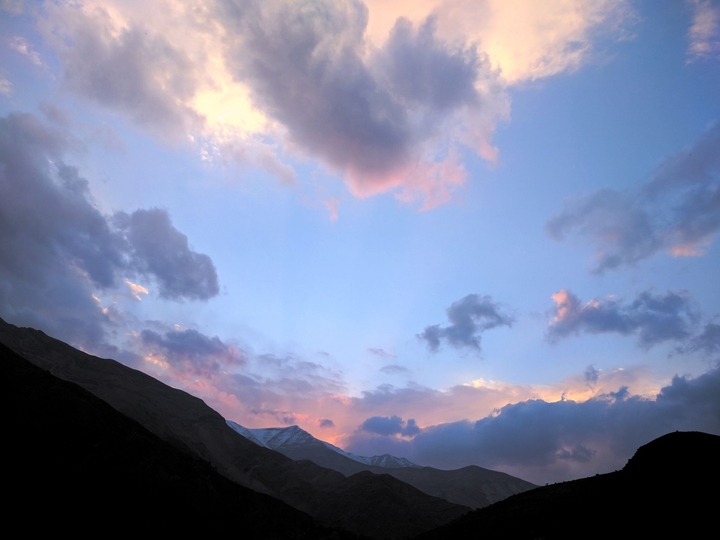 sunset behind mountains