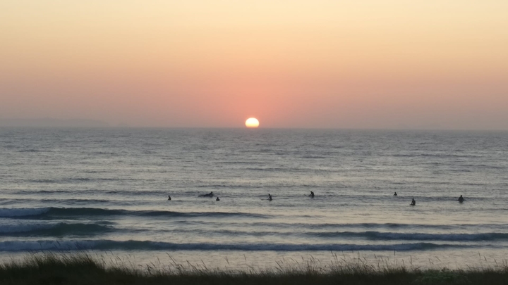 surfers and sunset