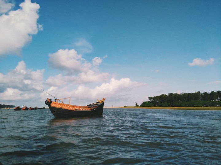 where the sky kisses the river & the sea both