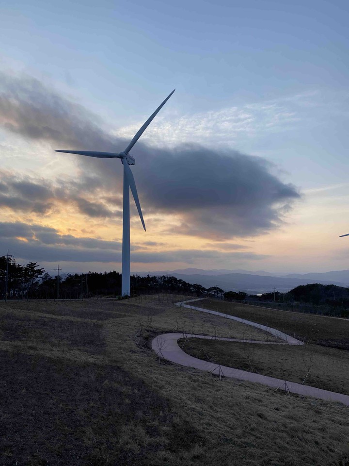 a windmill in the sunset