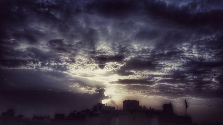 Sun behind clouds