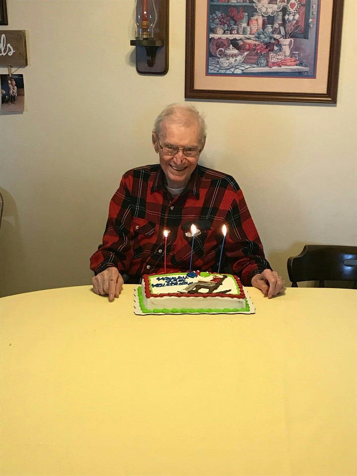 Dad with lit candles on cake