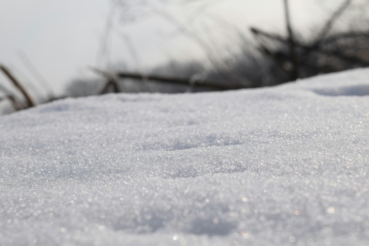 With ice and snow.