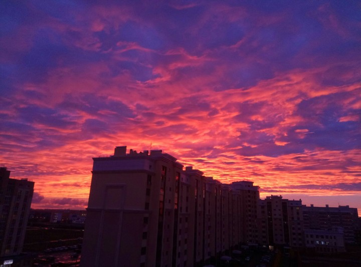 Sunset over the high-rise building