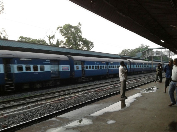 railway platform with passing a train