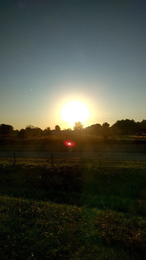 Sun over a road