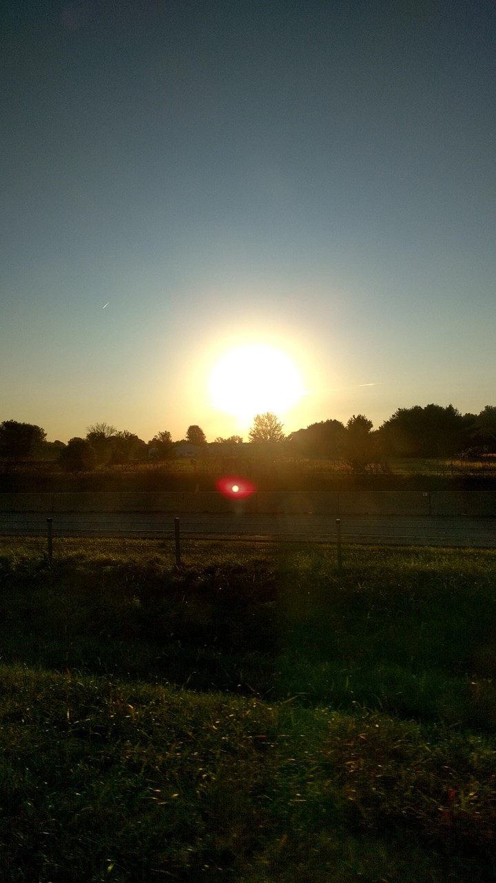 Sun over a road