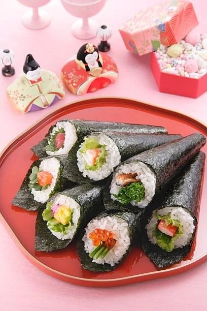 Hina dolls and sushi rolls