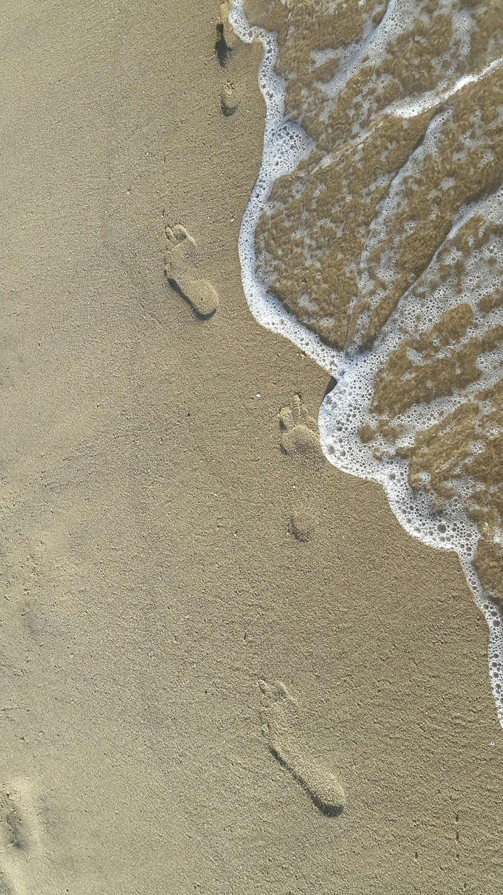 Footprints on the sand.