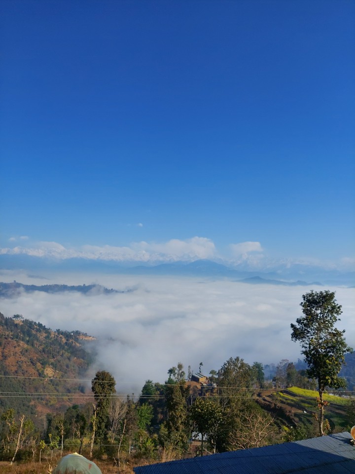 clouds above hills village