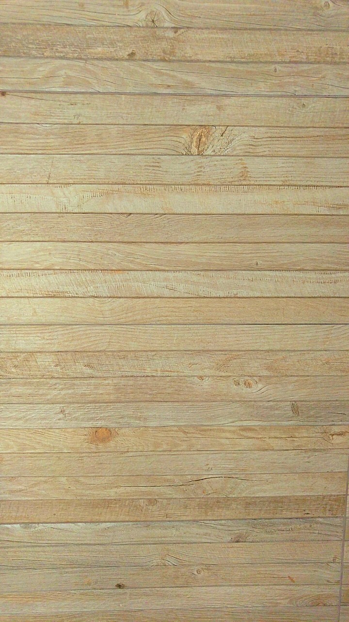 Against the wall
