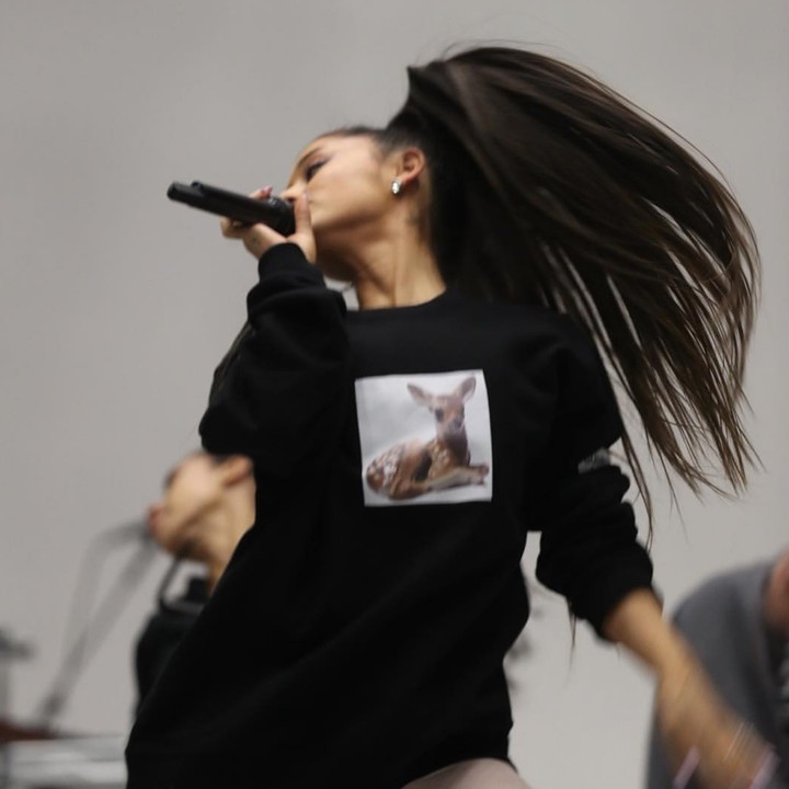 Ariana Grande hair flip