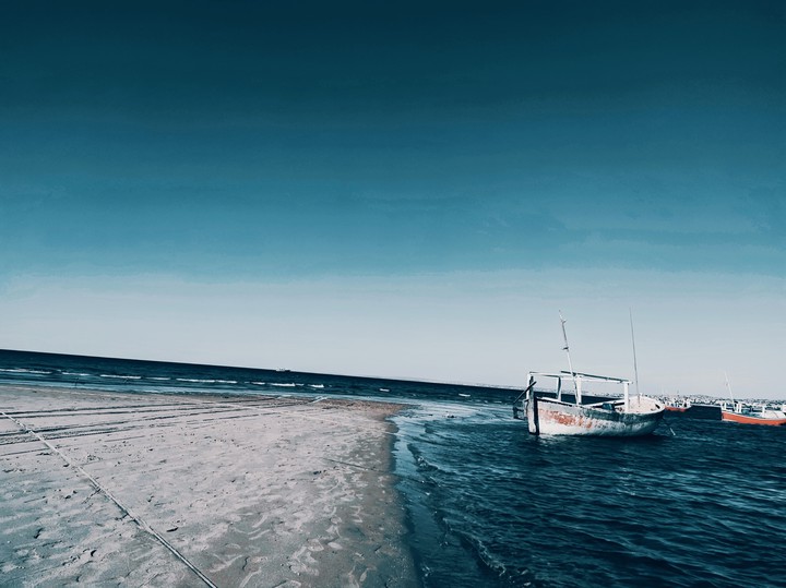 blue sea and random boat