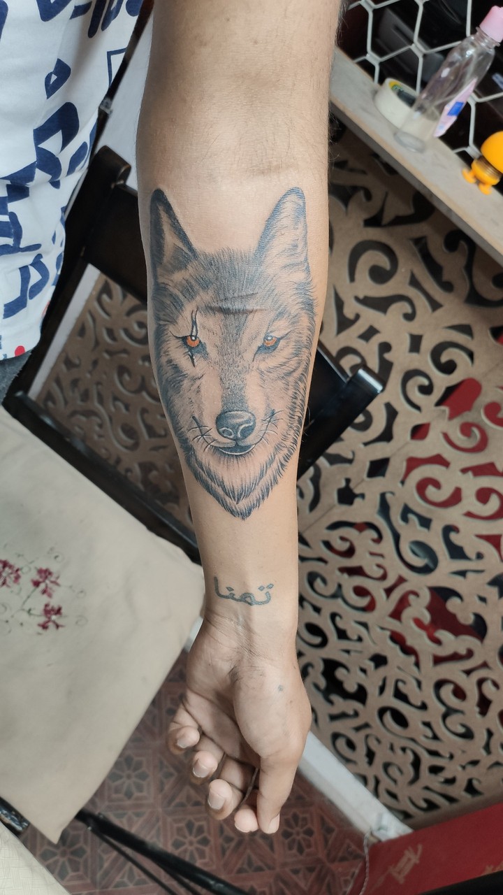 Cover-up wolf tattoo