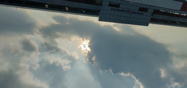 beautiful sun hidden behind cloud