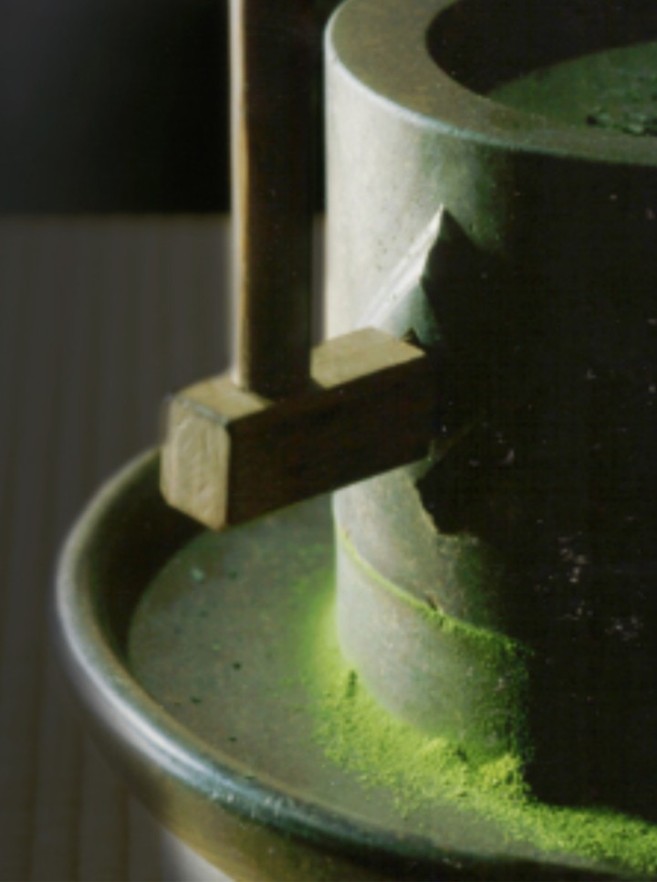 mill grinding tea leaves into matcha powder