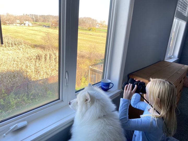 Ember and Nalah using Grandpa's binoculars