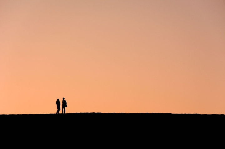 2 people enjoying sunset
