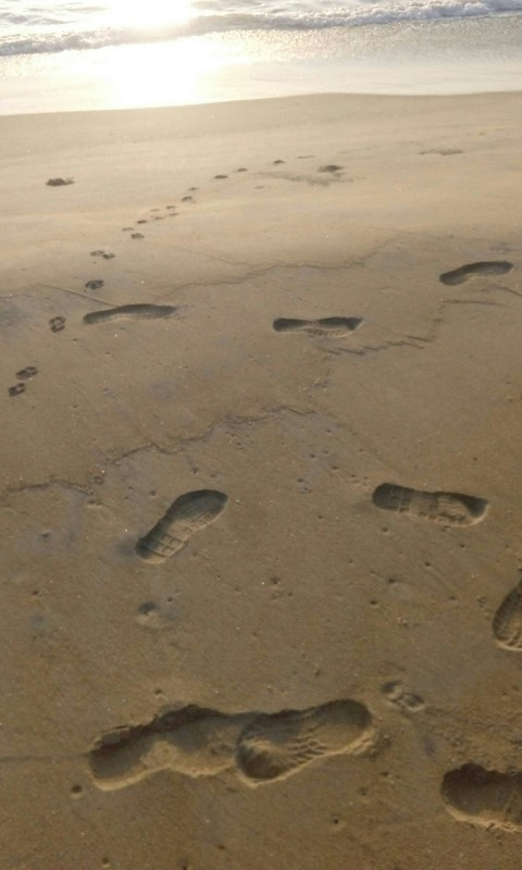 footsteps at seashore