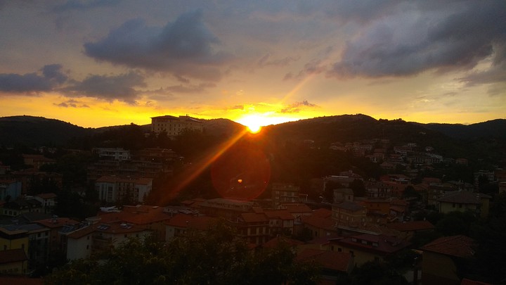Sun setting over hills