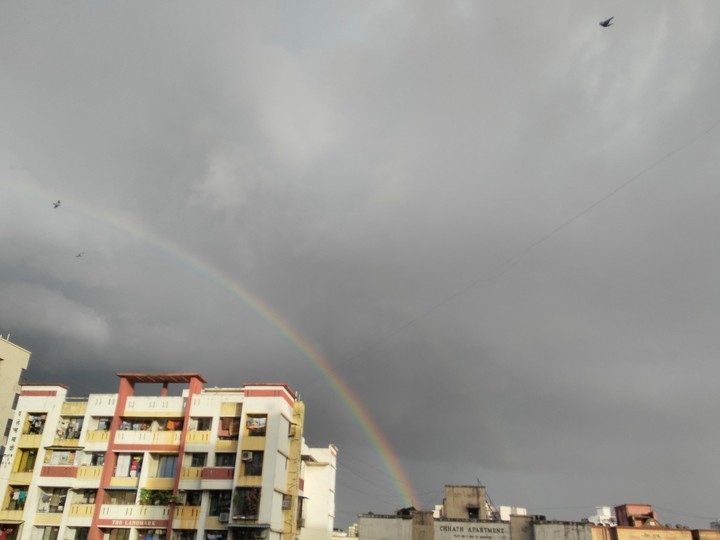 Rainbow over a building