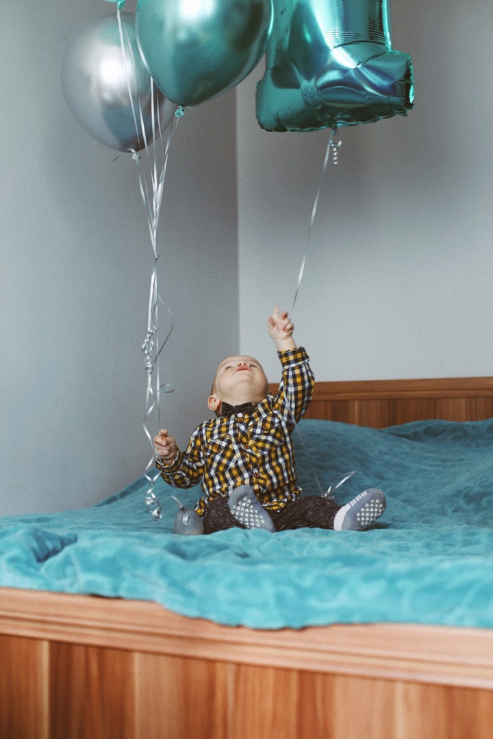 baby with balloons
