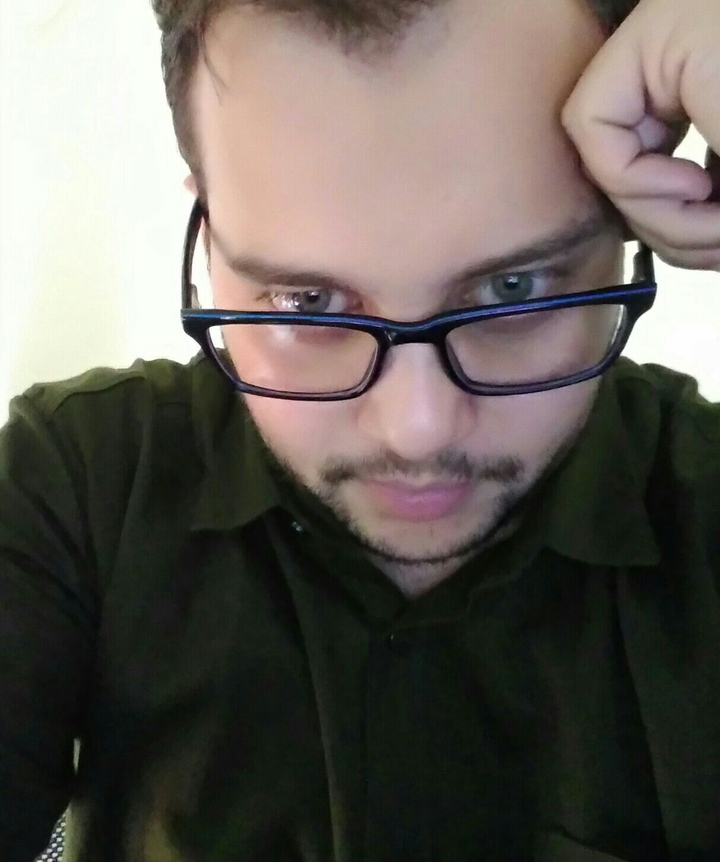 glasses with green eye