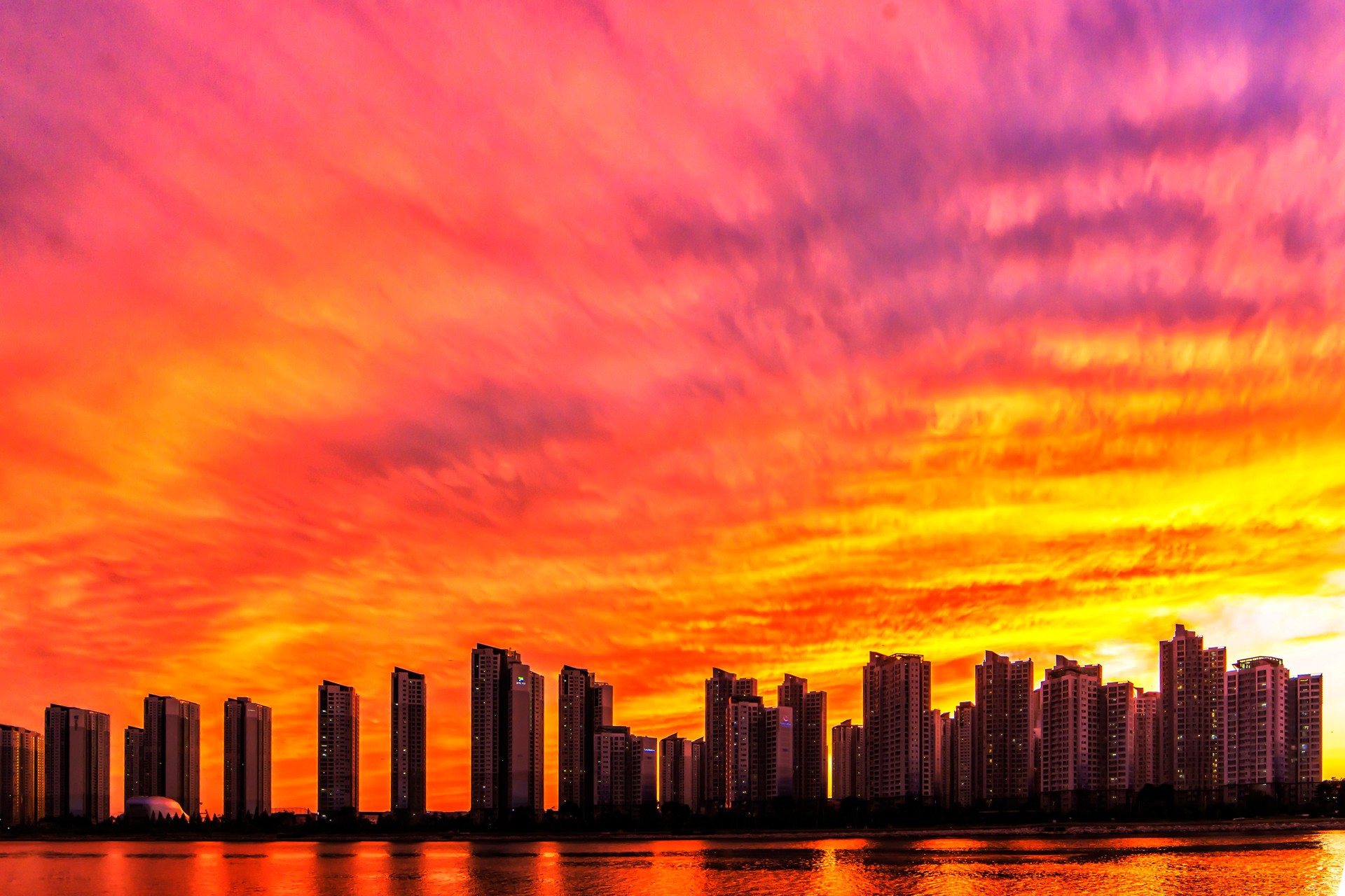 City covered by flaming sunset