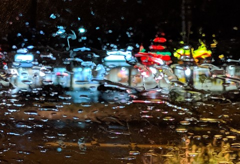 light through a wet windshield