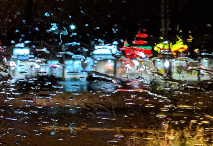 light through a wet windshield