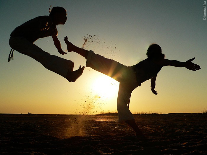 Capoeira mixes martial art, sport and music. Afro-brazilian